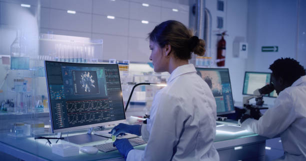 istock Multi ethnic research team studying DNA mutations. Female doctor in foreground 1224202620