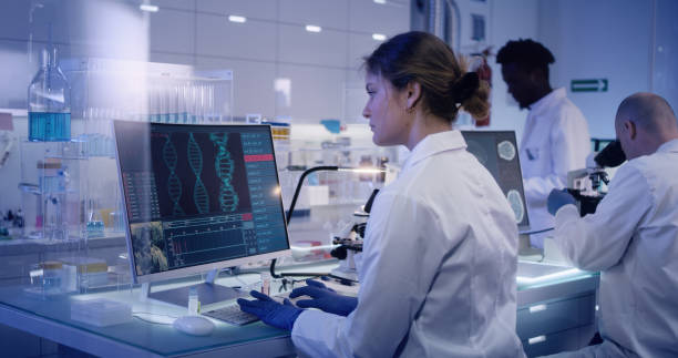 istock Multi ethnic research team studying DNA mutations. Female doctor in foreground 1224202775