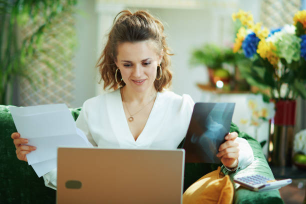 istock modern woman with documents and calculator choosing insurance 1224203072