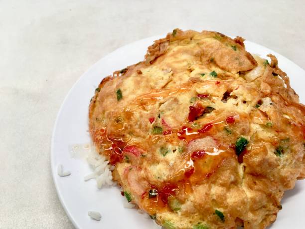 istock Omelette rice with chopped spring onions topped with sauce 1224203741