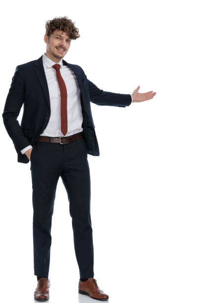 istock Smiling businessman presenting with his hand in his pocket 1224204141