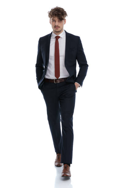 istock Serious businessman holding both hands in his pockets 1224204157
