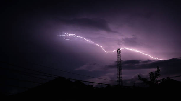 Real lightning bolt striked on the top of antenna tower in Trang Thailand at night Real single lightning bolt striked on the top of antenna tower in Trang Thailand at night lightning tower stock pictures, royalty-free photos & images