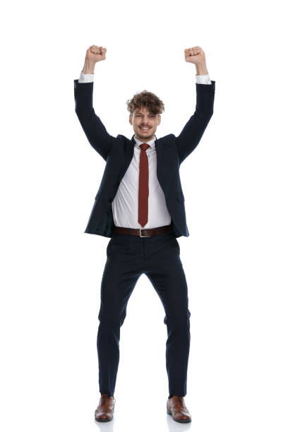 istock Cheerful businessman smiling and celebrating with both fists up 1224205657