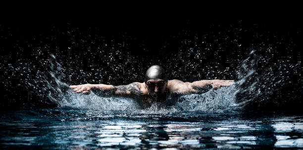 Man is swimming breaststroke. Water sports concept. stock photo