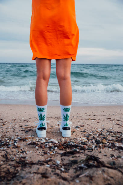 istock Woman on beach with marijuana socks 1224210108