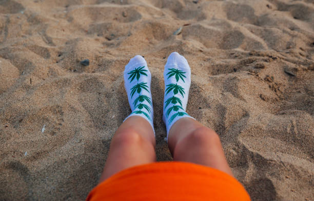 istock Woman on beach with marijuana socks 1224210272