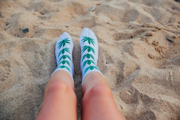 istock Woman on beach with marijuana socks 1224210473