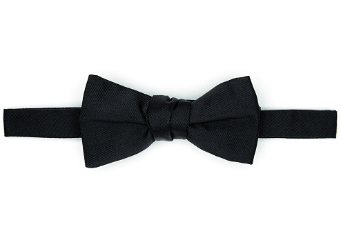 Classic black Bow Tie, black tuxedo accessories, isolated, classic man style. black bow tie isolated on white background, closeup.