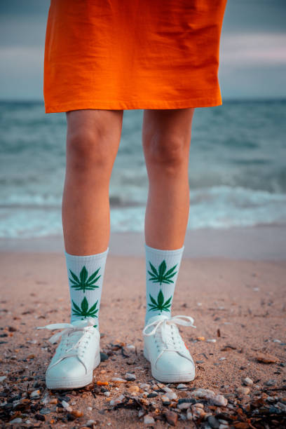 istock Woman on beach with marijuana socks 1224210681