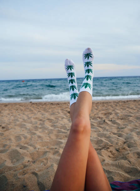 istock Woman on beach with marijuana socks 1224211562