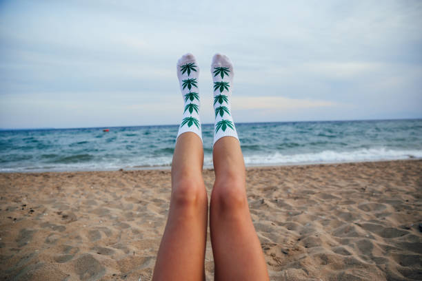 istock Woman on beach with marijuana socks 1224212151