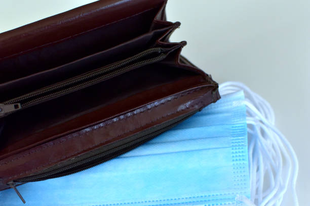 istock Empty wallet on the background of hygiene masks 1224213296