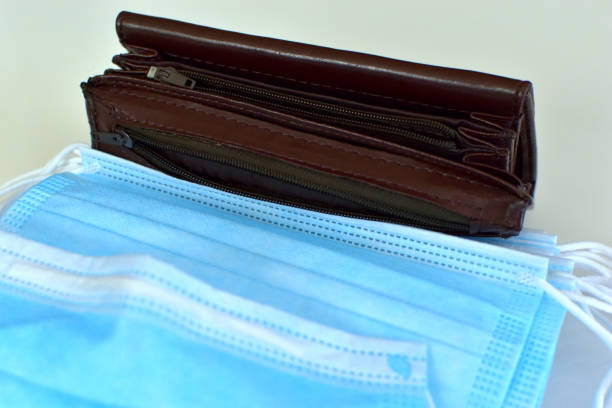 istock Empty wallet on the background of hygiene masks 1224213315