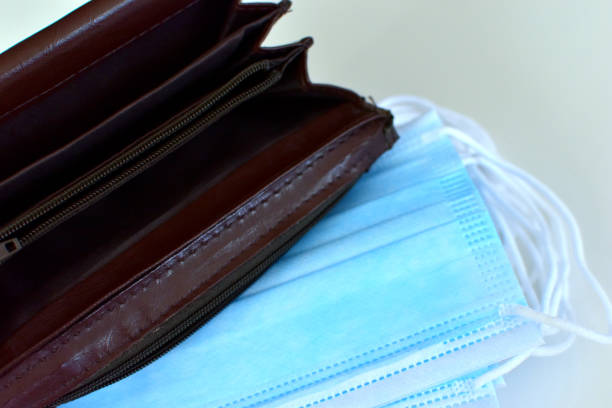 istock Empty wallet on the background of hygiene masks 1224213346