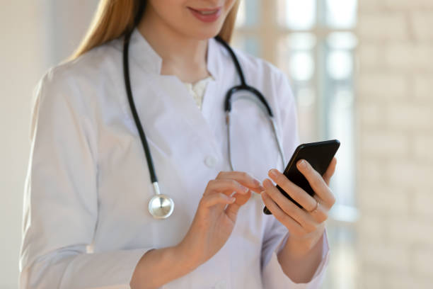 istock Female doctor consult patient on cell online 1224215525