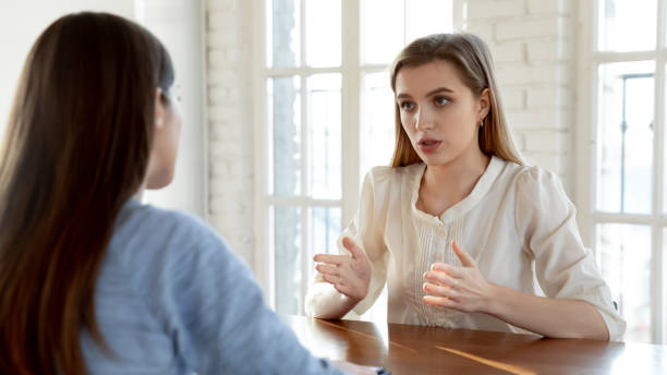 istock Confident female candidate talk with employer at interview 1224215582