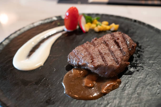 istock Delicious medium rare wagyu beef  steak with gravy sauce. 1224218114