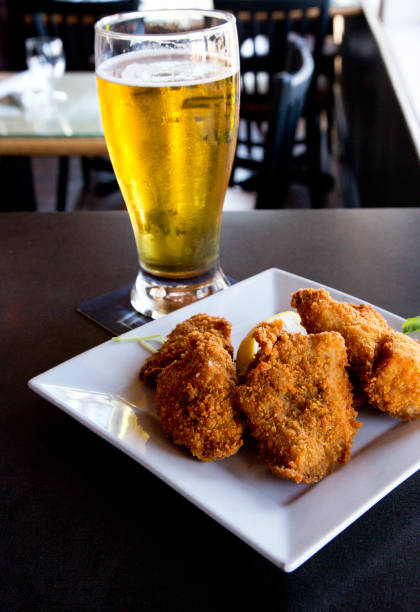 istock Crisp snapper fish bites and glass of beer 1224218362