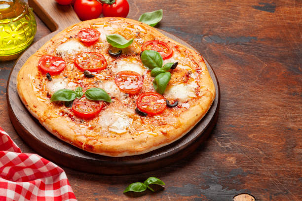 istock Tasty homemade pizza with tomatoes 1224219039