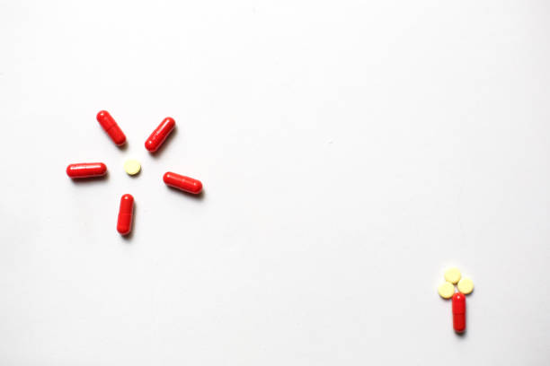istock Red medicines on a white background - tablets in capsules, pills in packages. 1224219861