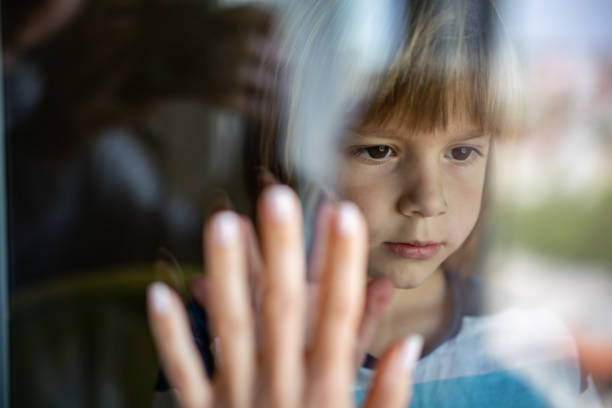 istock Close-up boy says goodbye to his mother before she goes to work 1224220668