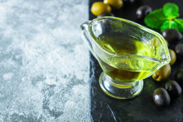 istock olive oil appetizer olives, cold pressed,  menu concept food background. top view. copy spaces for text for text keto or paleo diet 1224222003