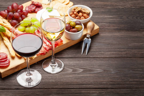 istock Cheese, meat, grapes and olives antipasto and wine 1224222093