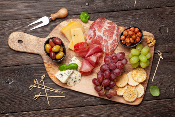 istock Cheese, meat, grapes and olives antipasto 1224222303