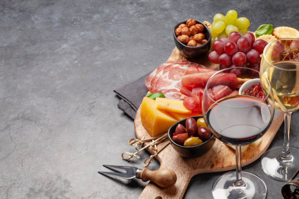 istock Cheese, meat, grapes and olives antipasto 1224222521