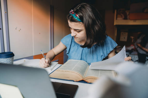 istock Adolescent girl is studying at home 1224222613