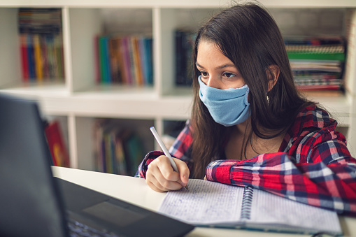 Teenage Girl Studying At Home During Covid19 Pandemic Stock Photo -  Download Image Now - iStock