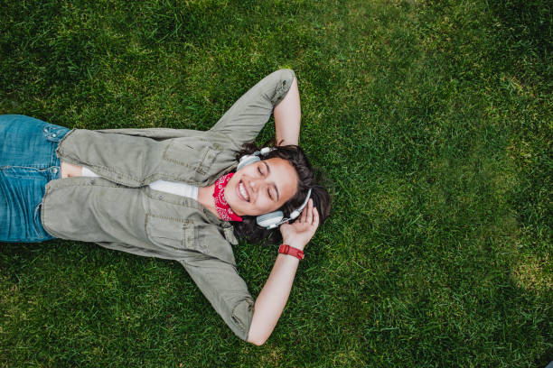 istock Young woman relaxing on the meadow 1224223663