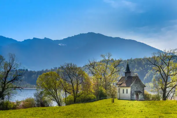 Photo of The historical St. Meinrad Chappel situated in an idyllic peninsula on the shores of the Upper Zurich Lake near Bollingen, st. Gallen, Switzerland