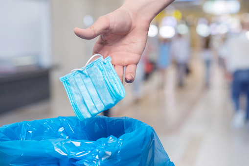 The concept of throwing disposable masks after use.