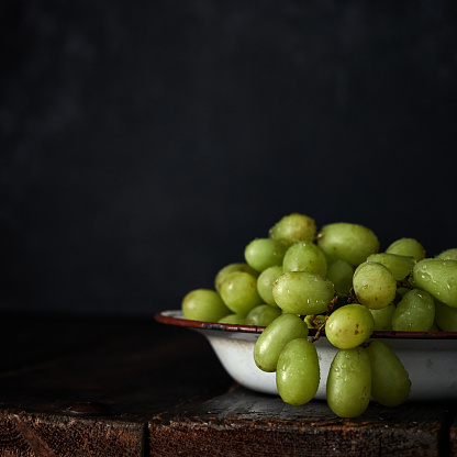 Fresh White Grapes on Rustic Background