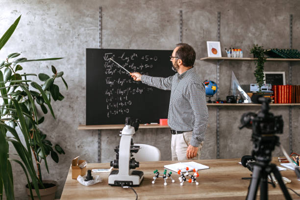 istock Man recording educational video for his vlog on camera 1224226557