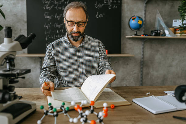 istock Male professor in front of blackboard in class 1224227284