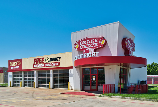 Humble, Texas/USA 05/10/2020: Brake Check automotive business exterior in Humble, TX located on North Sam Houston Pkwy. Texas chain store founded in 1968 offering brake, wheel alignment and oil change service.
