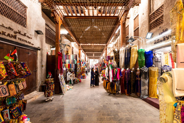 people shopping at the textile market in dubai - textile textile industry warehouse store imagens e fotografias de stock