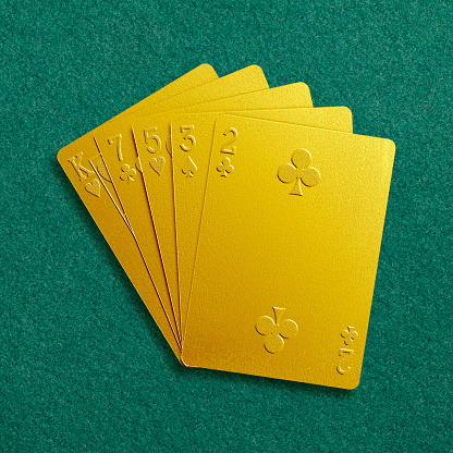 Playing cards photographed on green cloth