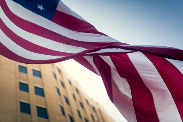 istock American Flag Waving and Building Architecture 1224231997