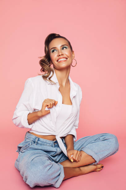 istock Girl dressed in 80s style sits on the floor at the studio 1224234514