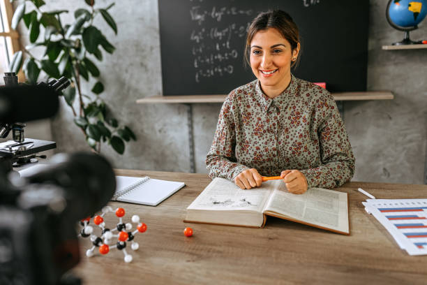 istock Woman recording educational video for her vlog on camera 1224237614