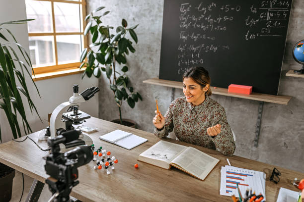 istock Woman recording educational video for her vlog on camera 1224237664