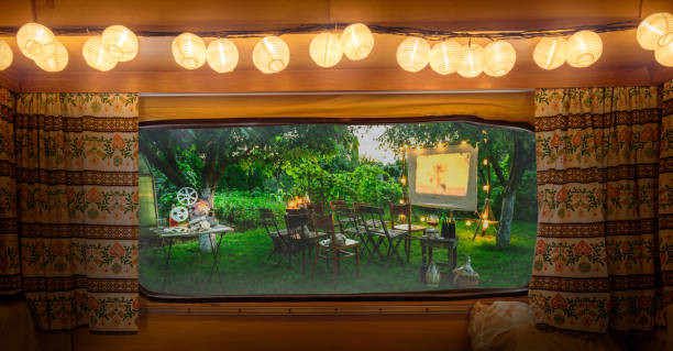 istock Summer cinema in the evening, view from camper window 1224238292