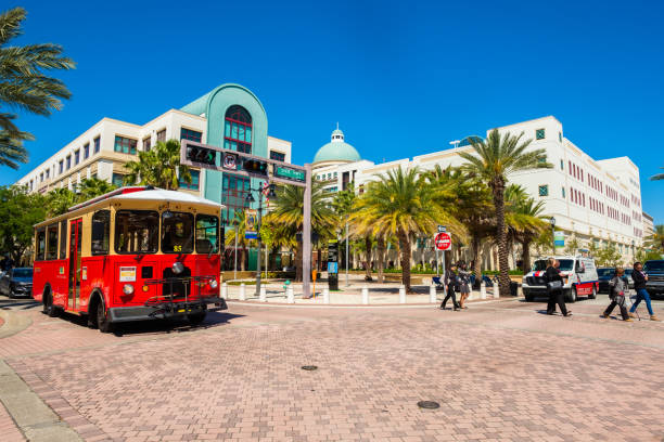 Downtown West Palm Beach Cityscape West Palm Beach, Florida USA - March 14, 2018: Cityscape view of the downtown district and the City Hall along popular Clematis Street. west palm beach stock pictures, royalty-free photos & images