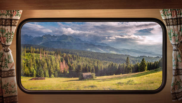 istock Green valley at sunset in Tatras, view from camper window 1224239230