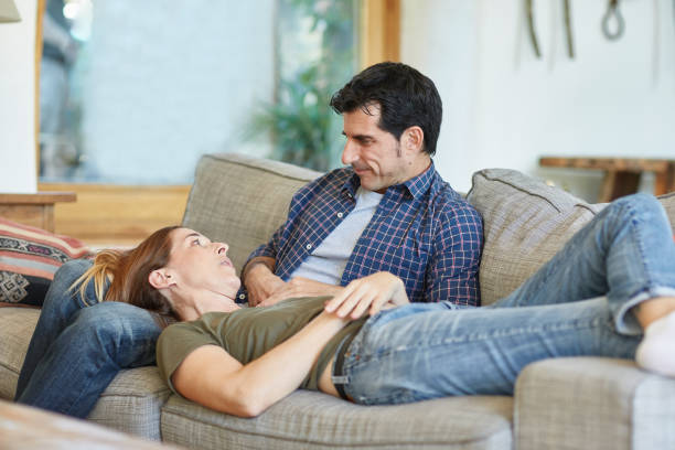 istock Mature Couple Enjoying Relaxed Weekend Leisure on Sofa 1224239496