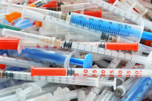 istock Heap of different disposable syringes 1224239674